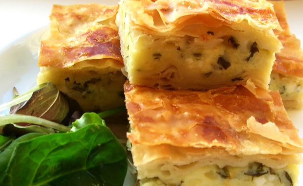 Layered pastries with feta cheese and parsley