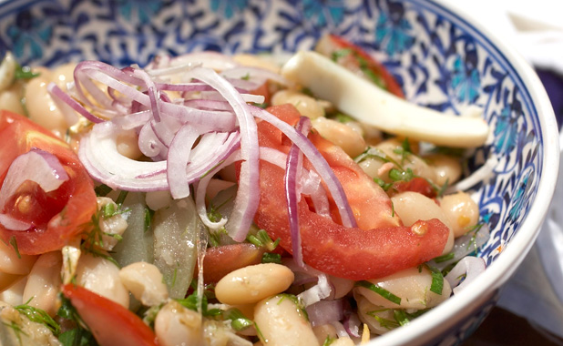 White bean salad with olive oil, onions and fresh parsley